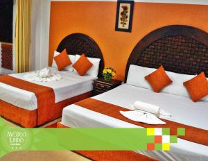 Una cama o camas en una habitación de Hotel Mexico Lindo