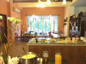 a kitchen with a counter with food on it at Cloudenjoy B&B in Hualien City