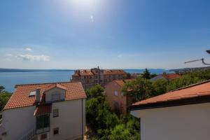 a view of the water from the roofs of buildings at Two-Bedroom Apartment in Crikvenica XXXVI in Dramalj
