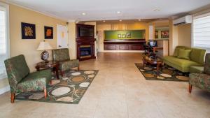 a living room with a couch and a fireplace at The Inn on Storrs in Mansfield Center
