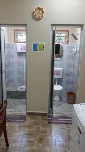 a bathroom with a shower and a toilet at KhainadzMuslim Homestay in Melaka