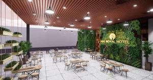 a rendering of a restaurant with tables and chairs at Hue Royal Hotel in Hue