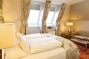Ένα ή περισσότερα κρεβάτια σε δωμάτιο στο Boutiquehotel Das Tyrol