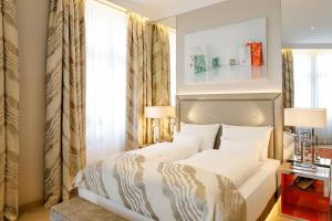 Ένα ή περισσότερα κρεβάτια σε δωμάτιο στο Boutiquehotel Das Tyrol