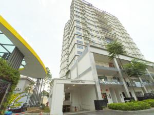 a tall building with palm trees in front of it at No.3 The Zen @ Puchong Skypod Residence in Puchong