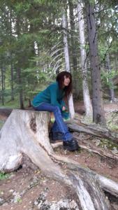 a woman sitting on top of a tree stump at Artenatura BeB in Terranuova Bracciolini
