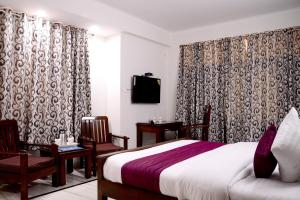 TV a/nebo společenská místnost v ubytování Hotel Sukhvilas