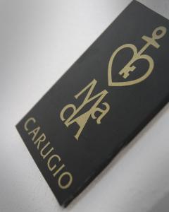 a black book with gold writing on it at MADA Charm Apartments Terrace&Carugio in Vernazza