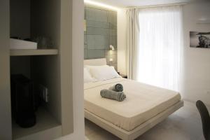 a bedroom with a bed with a towel on it at MADA Charm Apartments Terrace&Carugio in Vernazza