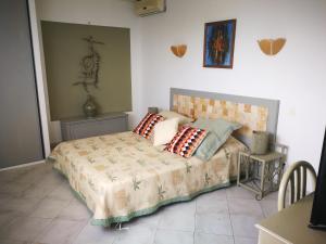 a bedroom with a bed with pillows on it at Levolle Marine in Poggio-Mezzana +68 photos
