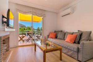 a living room with a couch and a table at Apartment Rosmare III in Alcudia