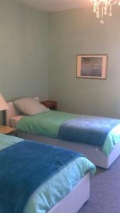 Un pat sau paturi într-o cameră la Maison Du Cheval