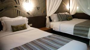 Postel nebo postele na pokoji v ubytování Bamboori Boutique Resort