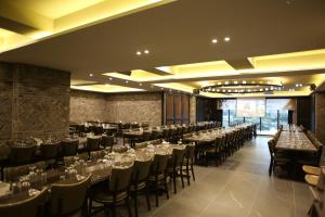 a large banquet hall with tables and chairs at Hotel Dongbang in Jinju