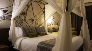 Postel nebo postele na pokoji v ubytování Bamboori Boutique Resort + 37 fotografií