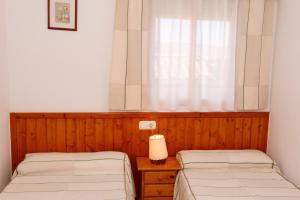 Posteľ alebo postele v izbe v ubytovaní Casa Enpiera II - Turistrat