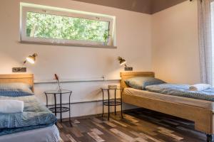 Postel nebo postele na pokoji v ubytování Apartmány Pod Lesem II