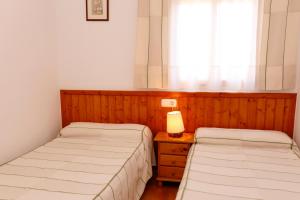 Posteľ alebo postele v izbe v ubytovaní Casa Enpiera II - Turistrat