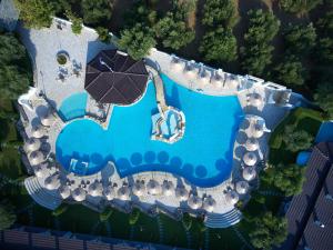 an overhead view of a swimming pool with umbrellas at Acrotel Athena Residence in Elia
