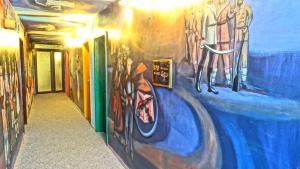 a hallway with paintings on the walls of a building at Hotel Simona Complex in Sofia