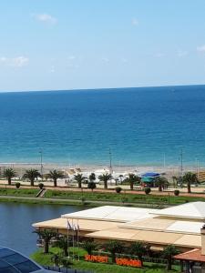 a view of the beach and the ocean from a building at Mari Apartment in Batumi