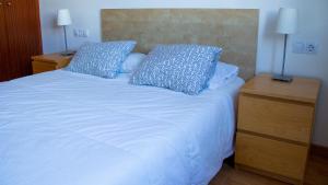 Кровать или кровати в номере Apartamento en la Magalona