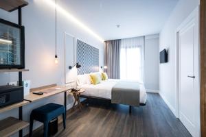 Cama o camas de una habitación en Hotel Villa Victoria By Intur