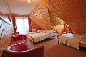 Кровать или кровати в номере Na Wierchu