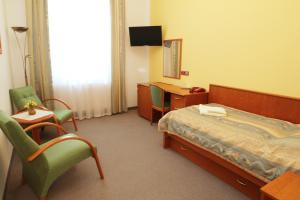 Posteľ alebo postele v izbe v ubytovaní Lázeňský Hotel Sadový Pramen