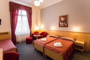 Posteľ alebo postele v izbe v ubytovaní Lázeňský Hotel Sadový Pramen
