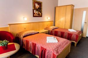 Posteľ alebo postele v izbe v ubytovaní Lázeňský Hotel Sadový Pramen