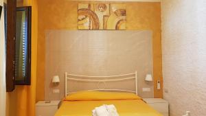 Ένα ή περισσότερα κρεβάτια σε δωμάτιο στο B&B Borgo Santa Margherita +80 φωτογραφίες