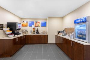 a fast food restaurant with a counter with açaí at Comfort Inn & Suites in Bowmanville
