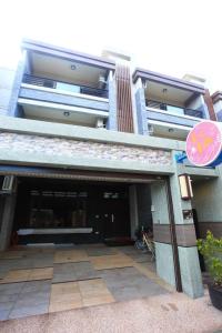 an entrance to a building with a garage at Childlike Innocence Homestay in Ji'an