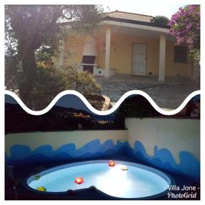 a swimming pool in the backyard of a house at Villa Jone in Diano Marina
