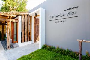 a building with a sign that reads the humble villas at The Humble Villas in Ban Bang Po