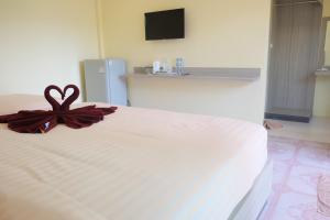 Postel nebo postele na pokoji v ubytování Chokdee Resort
