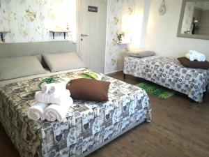Cama o camas de una habitación en San Pietro Shabby Chic Apartment