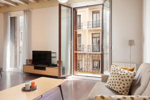 Sjónvarps- og/eða afþreyingartæki á Rent Top Apartments near Plaza de Catalunya