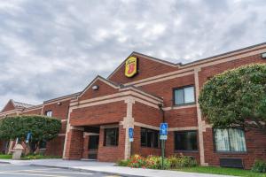 a building with a mcdonalds sign on top of it at Super 8 by Wyndham Elgin in Elgin