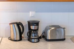 a coffee maker and a toaster on a kitchen counter at Villa Tasos Koutsoubos in Koroni