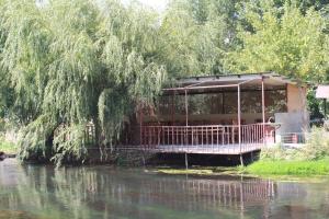 a house on the banks of a river at Getap in Bjni in Bjni