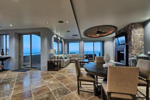 a living room with a table and a couch at Amazing Penthouse at Bella Sirena with Views and Entertainment - 901-C in Puerto Peñasco