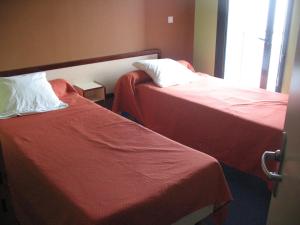 Postel nebo postele na pokoji v ubytování HOME DU BUISSON Hôtel des Familles
