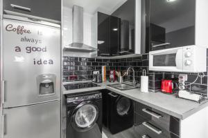 Kuchyň nebo kuchyňský kout v ubytování Chueca Apartment