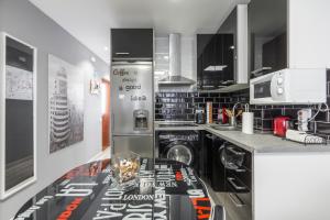 Kuchyň nebo kuchyňský kout v ubytování Chueca Apartment