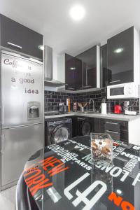 Kuchyň nebo kuchyňský kout v ubytování Chueca Apartment