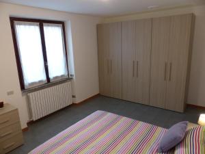 Posteľ alebo postele v izbe v ubytovaní Casa di Roberta