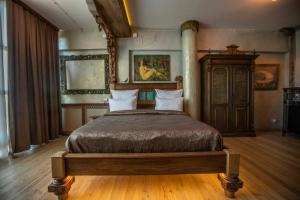 a bedroom with a large bed in a room at Artists Residence in Tbilisi in Tbilisi City