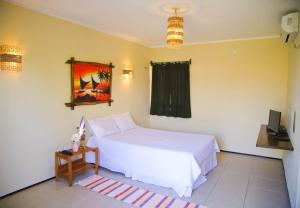 Voodi või voodid majutusasutuse Pousada Coqueiro Beach toas